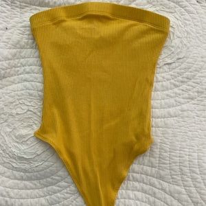 Yellow body suit